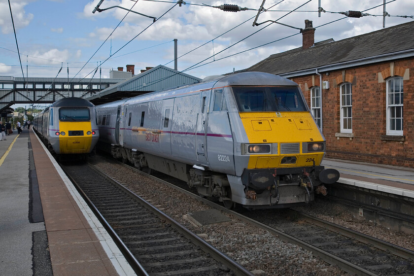 43300, GR 12.30 London King's Cross-Edinburgh Waverley (1D13) & 82224, GR 12.05 Leeds-London King's Cross (1A29), Grantham station 
 A crossing of East Coast services at Grantham station. To the left, the 12.30 King's Cross to Edinburgh HST service leaves with power car 43300 at the rear. Meanwhile, DVT 82204 waits to leave with the 12.05 Leeds to King's Cross train. For a relatively modestly sized East Midland's town Grantham station is busy with much railway activity to keep the enthusiast happy. 
 Keywords: 43300 12.30 London King's Cross-Edinburgh Waverley 1D13 82224 12.05 Leeds-London King's Cross 1A29 Grantham station East Coast DVT HST