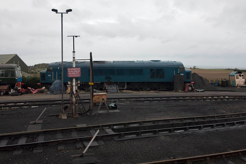 D182 (46045), stabled, Weybourne Yard 
 Taken from The North Norfolkman dining train as it enters Weybourne D182 (ex. 46045) is seen on-shed along with one of the resident class 101 DMUs. 
 Keywords: D182 46045 stabled, Weybourne Yard