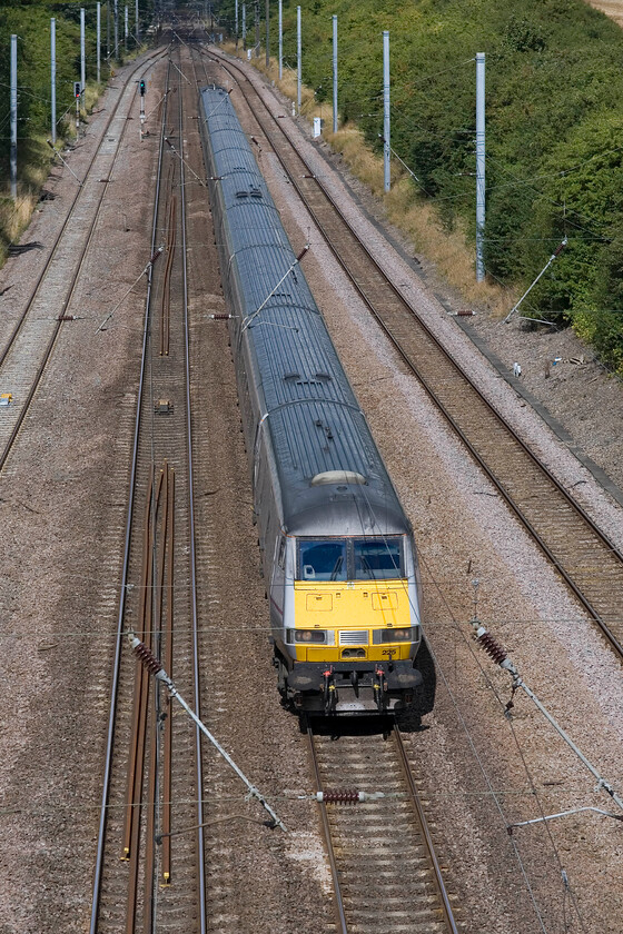 82225, 10.15 Leeds-London King's Cross (1A22), Westby SK962271 
 Having surmounted Stoke bank from the north and passed through the tunnel (just around the corner in the very distance) the 10.15 Leeds to King's Cross begins the long descent to Peterborough. The East Coast service is led by DVT 82225 with a Class 91 providing the power at the rear. 
 Keywords: 82225 10.15 Leeds-London King's Cross 1A22 Westby SK962271 East Coast DVT