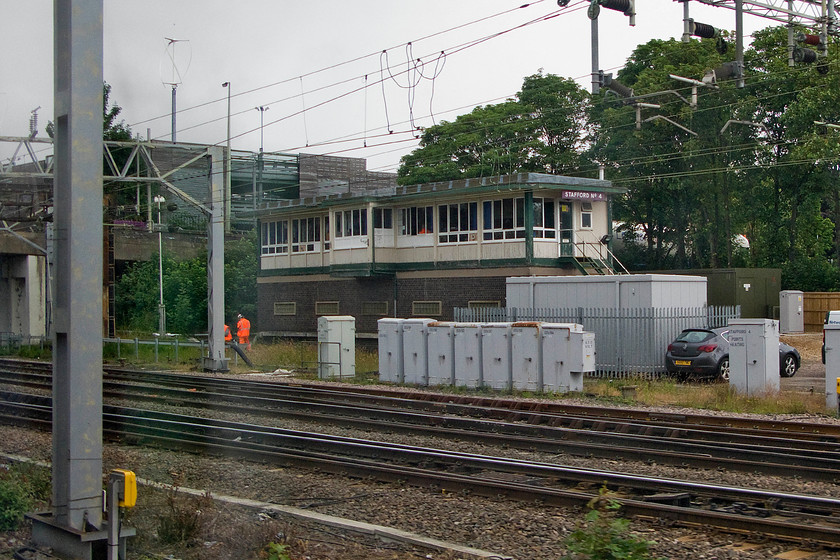 Stafford No. 4 signal box (BR, 1960) 
 Not a great picture of Stafford No. 4 signal box taken through the train window but with only some three weeks left in service before being decommissioned I have included it. No. 4 box is a British Railways (LMR) type 15 structure with a one hundred and five lever frame that was opened in 1960. I suspect that it will be demolished pretty quickly after its closure at the start of next month but I hope that somebody will save the large British Railways enamel sign hanging above the steps.

PS The box closed on 01.08.15 and was demolished over the 15 & 16.09.15 
 Keywords: Stafford No. 4 signal box BR 1960 Stafford number 4 signal box