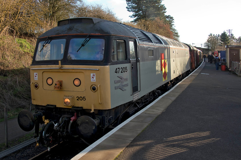 47205, 14.00 Pitsford return, Pitsford and Brampton station 
 Looking very smart in its Railfreight grey livery as worn in the last phase of its working life on the mainline, 47205 waits at Pitsford and Brampton station with the 14.00 return working. My family and I took this train enjoying being served an orange juice and mince pie. 47205 was new to traffic in July 1965 as D1855. It became 47205 under TOPS in 1974, a number it wore until 1994 when it was renumbered 47395. This was only for just over a year after it reverted back to be 47205 again in 1995, and it stayed as that until withdrawal in 2001. 
 Keywords: 47205 14.00 Pitsford return Pitsford and Brampton station