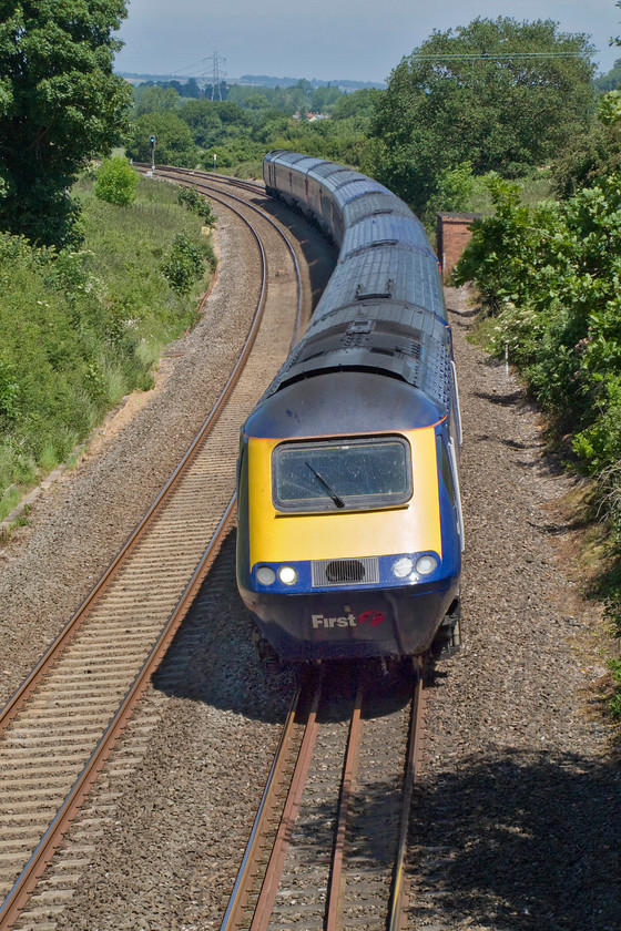 Class 43, GW 11.33 London Paddington-Exeter St. David`s (1C81), Poole ST154220 
 An unidentified class 43 HST negotiates the winding and steep climb of Whiteball bank between Taunton and Wellington. The First Great Western service is the 11.33 Paddington to Exeter St. David's that has just under twenty-five miles left of its journey from here at Poole just outside of Wellington in Somerset. 
 Keywords: Class 43 HST 11.33 London Paddington-Exeter St. David`s 1C81 Poole ST154220 First Great Western