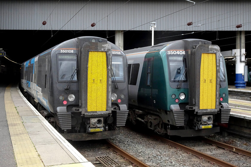 350108, LN 12.56 London Euston-Coventry (1Y25, 1L) & 350404, LN 12.52 London Euston-Milton Keynes Central (2K21, RT), London Euston station 
 Poking their noses out from within the gloom of Euston station two Desiros are seen. To the right 350404 will work the 2K21 all-stations stopper 12.52 to Milton Keynes whilst on the left is our train back from London to Northampton. We travelled aboard 350108 working the 12.56 to Coventry which was terminating earlier than normal due to engineering works near Birmingham International. 
 Keywords: 350108 12.56 London Euston-Coventry 1Y25 350404 12.52 London Euston-Milton Keynes Central 2K21 London Euston station London Northwestern Desiro