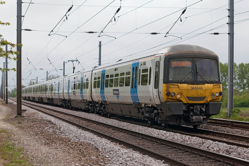 365540, GE 12.22 London Kings Cross-Peterborough (1P52, 1L), White House Crossing TL227777 
 365540 leads a two-car set past White House Crossing forming the 12..2 London King's Cross to Peterborough. These late 1990 built class 365s have been good performers on this line but face an uncertain future as new trains are due to replace them. 
 Keywords: 365540 1P52 White House Crossing TL227777