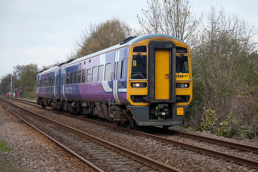 158817, NT 13.08 Bridlington-Sheffield (1J48, 4L), Cottingham foot crossing 
 Just to the north of Cottingham station is a foot crossing. Having passed the level crossing over Northgate, 158817 slows for its stop at the station passing the busy foot crossing with the 13.08 Bridlington to Sheffield. This service requires the train to reverse at Hull, the next station after Cottingham. 
 Keywords: 158817 13.08 Bridlington-Sheffield 1J48 Cottingham foot crossing