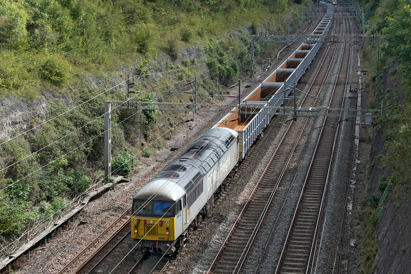 56103, 12.32 DB Cargo Fan (Wembley)-Humberstone Road (6Z35, 12L), Roade cutting 
 I had been watching this working on RTT intrigued as to what it actually was. Postings revealed that it was a long rake of empty wagons heading north and they were not wrong! 56103 leads thirty-five brand new JNA box wagons through Roade cutting with 60046 out of sight on the rear. The train was running as 6Z35 heading to Humberstone Road in Leicester where the train would be split with twenty of the wagons heading to Long Marston later in the day and the remainder staying in Leicester. The pair of locomotives had worked up to Wembley earlier in the morning from Toton via the MML and then crossing to the WCML using the Marston Vale route. 
 Keywords: 56103 12.32 DB Cargo Fan Wembley Humberstone Road 6Z35 Roade cutting