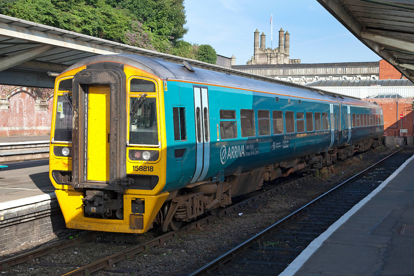 158818, stabled, Shrewsbury station 
 158818 stands in Shrewsbury's bay platform five. As can be seen, it was a glorious summer morning, and unusually, it stayed like this all day with perfect blue skies! 
 Keywords: 158818 Shrewsbury station