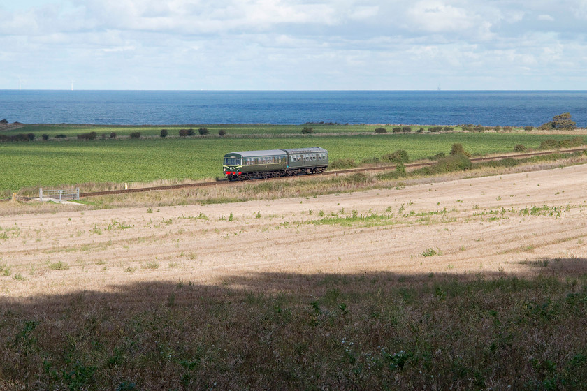 M51192 & M56352, 12.15 Holt-Sheringham, Weybourne TG125424 
 With the vast expanse of the North Sea in the background, class 101 DMU M51192 and M56352 work along the North Norfolk Railway forming the 12.15 Holt to Sheringham. The picture is taken from the footpath that links Weybourne station with Sheringham Park. It is very popular with walker, cyclists and horse riders alike. For considerable lengths, it affords lovely views such as this.