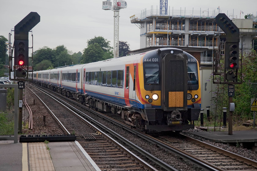 450031 & 450035, SW 17.39 London Waterloo-Porstmouth Harbour (1T55, 3L), Winchester station 
 450031 and 450035 slows for its stop at Winchester station forming the 17.39 Waterloo to Portsmouth Harbour. 
 Keywords: 450031 450035 1T55 Winchester station