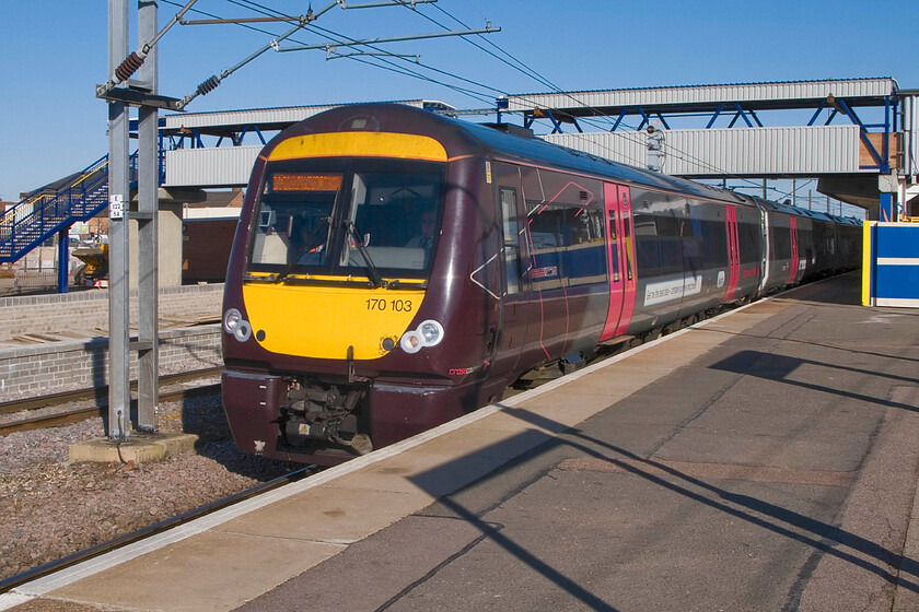 170103, XC 07.22 Birmingham New Street-Stansted Airport, Peterborough station 
 The reconstruction of Peterborough station continues with more platforms being added to the western side and an extension to the footbridge as seen here. 170103 leaves the station in some welcome spring sunshine working the 07.22 Birmingham New Street to Stansted Airport service. 
 Keywords: 170103 07.22 Birmingham New Street-Stansted Airport Peterborough station CrossCountry