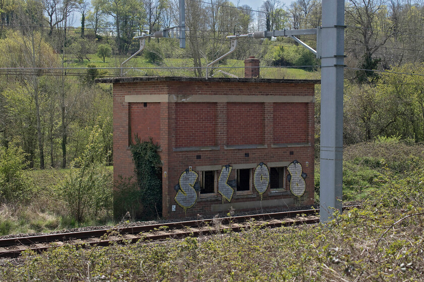 1. Wootton Bassett Incline signal box (BR, 1952) 
 Over the years I must have passed this rather sorry looking signal box countless times whilst travelling up and down the GWML but I never spotted it until exactly a month ago today when travelling back from Bath to Didcot. As we were now heading towards Somerset (sort of passing close by on the M4) I persuaded my wife to allow me to take us off route very slightly so I could take a photograph. Once named Wootton Bassett Incline signal box it was a block post between Wootton Bassett West and Dauntsey boxes but only had a ridiculously short working life. It was built by British Railways, opening in 1952 but closing just ten years later. The SRS website shows that the box also controlled an up and a down refuge siding. Remarkably, it is still standing and even more so that it survived the electrification process evidence of which can be seen in the foreground. 
 Keywords: Wootton Bassett Incline signal box British Railways 1952