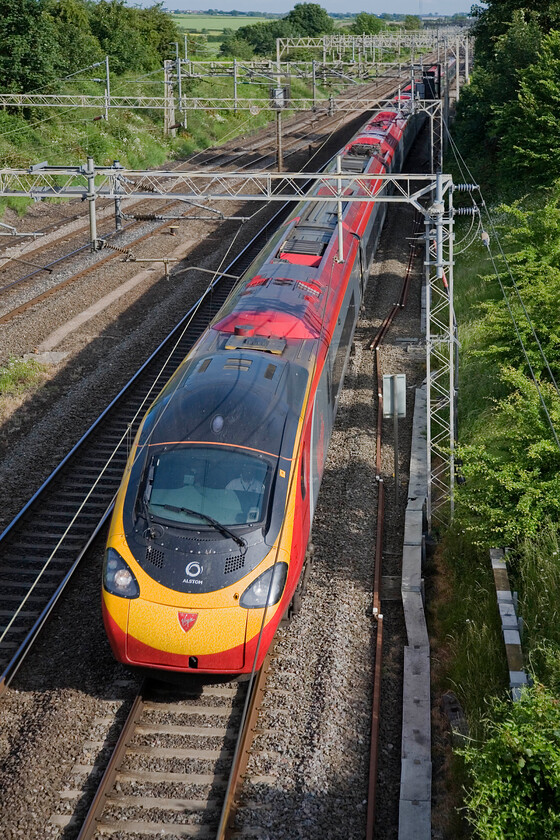 Class 390, VT 17.20 London Euston-Wolverhampton, Victoria bridge 
 In some lovely early evening sunshine an unidentified Class 390 Pendoino heads north past Victoria bridge between Roade and Ashton working the Virgin 17.20 Euston to Wolverhampton service. 
 Keywords: Class 390 17.20 London Euston-Wolverhampton Victoria bridge Virgin Pendolino