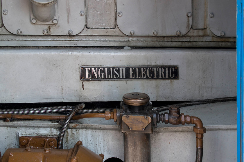 Engine, 31289, 13.00 Pitsford-Pitsford return, Pitsford & Brampton station 
 With one of the bodyside doors opened up, the engine of 31289 is revealed with its English Electric plate attached. These English Electric 12SVT engine (as used in the class 37) are de-rated to 1,470 bhp and were retrospectively fitted from 1964 following dreadful reliability problems with the Mirrlees JVS12T 1,250 bhp units that were installed from new. A situation all too typical of the time with many rushed and botched modernisation plans. 
 Keywords: Engine 31289 13.00 Pitsford-Pitsford return Pitsford & Brampton station