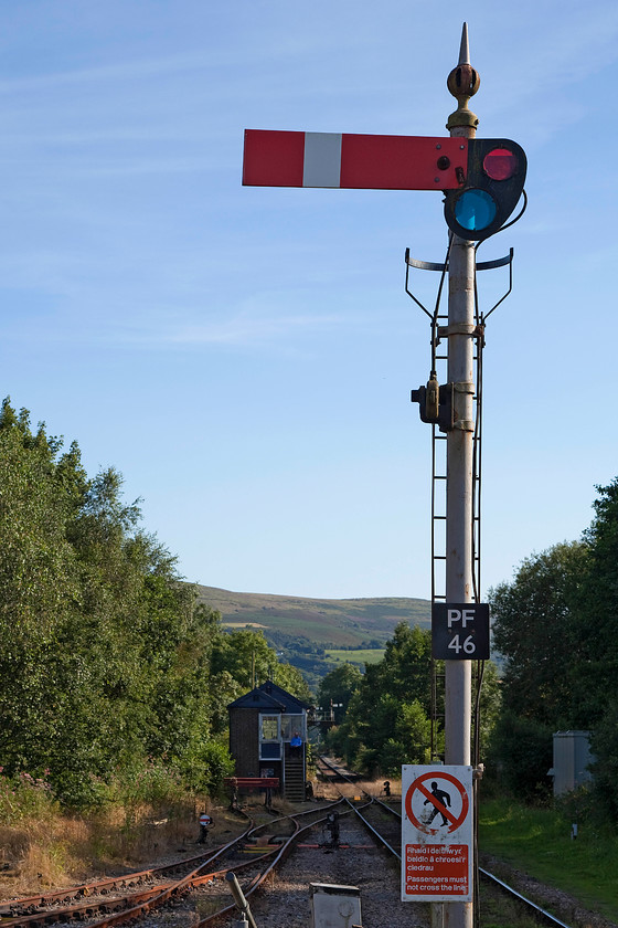 Pantyffynnon signal box (GWR, 1892) & up starter signal 
 Pantyffynnon signal box is seen a short distance from the station of the same name. The box is a GWR Type 5 that opened in 1892. It controls a number of semaphores on the Central Wales (now referred to as the Heart of Wales) line. It also controls access to the freight only Gwaun-Cae-Gurwen line for removal of coal from the open cast mine. Unfortunately, this is as close as I could get to the box. 
 Keywords: Pantyffynnon signal box up starter signal