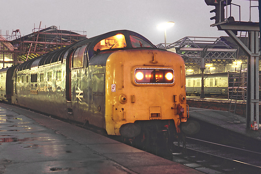 55022, 16.30 Hull-London KIng's Cross (1A28), Hull station 
 55022 'Royal Scots Grey' stands at Hull station waiting to leave with the 16.30 to King's Cross. Notice in this photograph the larger square around the footstep above the buffer beam. This was a unique identifier to 55022 and marked the spot where it once had an experimental flashing light fitted. Also notice the oil lamp sitting on the platform ramp at the base of the colour light that appears to be lit given the red light reflected.

There is an audio recording of this event on my Youtube channel, see..... https://youtu.be/KeTVheQqth8 
 Keywords: 55022 16.30 Hull-London KIng's Cross 1A28 Hull station Royal Scots Grey Deltic