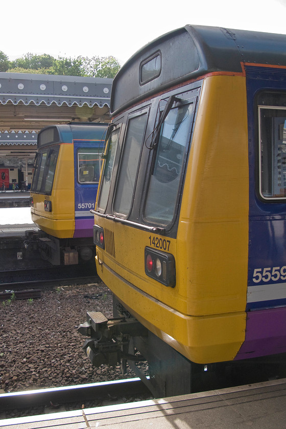 142007, 09.06 Sheffield-Leeds (2L18) & 142051, NT 09.29 Sheffield-York (2Y80), Sheffield station 
 A familiar scene at Sheffield station for many years finds two Pacers side-by-side at platforms three and four. 142007 will work the 09.06 to Leeds via Wakefield whilst 142051 will leave a little later with the 09.29 to York. Whilst the front ends of these two units look to be identical note that 142007 has the small manual type destination screen whilst 142051 has the full-size electronic version. 
 Keywords: 142007 09.06 Sheffield-Leeds 2L18 142051 09.29 Sheffield-York 2Y80 Sheffield station Pacer Northern Rail