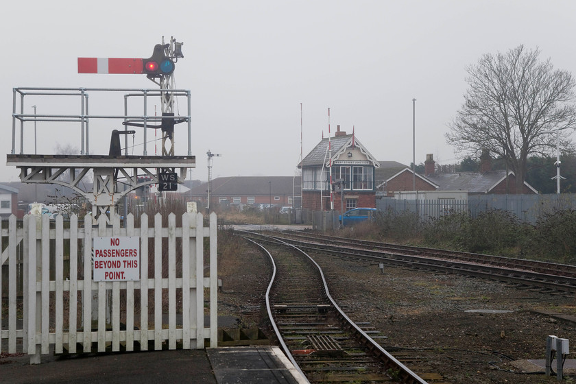 Boston West Street Junction Signal Box (GN, 1874) & up starter 
 Taken from the platform end at Boston station the up starter bracket is seen with one of its arms and short posts removed. In the background the handsome and typically styled West Street Junction signal box. This is the oldest surviving Great Northern box dating from 1874. It is listed as a Grade II structure by Historic England so its future is likely to be secure in some form or another. 
 Keywords: Boston West Street Junction Signal Box GN 1874 up starter