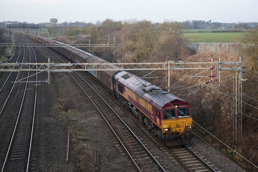 66121, 14.05 Daventry-Dollands Moor (6O67), Victoria Bridge 
 The only freight of this Saturday afternoon walk was the regular 14.05 Daventry to Dollands Moor empty cargo vans. This 6O67 flow is returning empty to the Kent Yard having brought up thousands of plastic bottles of spring water imported from the continent. This six day per week return trip is one that helps to satisfy the nations insatiable appetite to consume expensive bottled water rather than running a tap! 
 Keywords: 66121 14.05 Daventry-Dollands Moor 6O67 Victoria Bridge