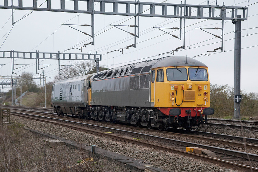 56081 & 82035, 13.00 Wembley-Loughborough Brush (5Z56), Ashton Road bridge 
 Veteran motive power utilised on the WCML as 56081 tows Chiltern Railways 82035 past Ashton Road bridge just south of Roade. The DVT was being towed to Loughborough's Brush works for attention as the 13.00 ex. Wembley. 
 Keywords: 56081 82035 13.00 Wembley-Loughborough Brush 5Z56 Ashton Road bridge