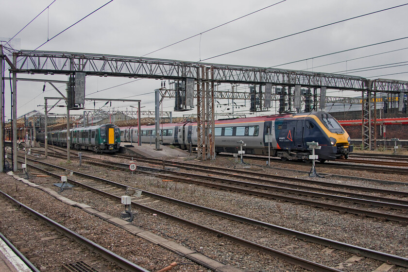 350114, LN 16.33 Crewe-London Euston (1U38, RT) & 221109, VT 13.58 Holyhead-London Euston (1A48, 1E), Crewe station 
 My final photograph of the day and a pretty tame one it is too! Whilst 350114 waits to leave with the 16.33 London Northwestern service to Euston Avantis 221109 gets away with the 13.58 Holyhead to Euston train. Both trains will take identical routes on their respective journeys to the capital but ultimately, the Voyager will arrive first (by over an hour) with faster operating speeds and fewer stops. 
 Keywords: 350114 16.33 Crewe-London Euston 1U38 221109 13.58 Holyhead-London Euston 1A48 Crewe station London Northwestern Desiro Avanti West Coast Voyager