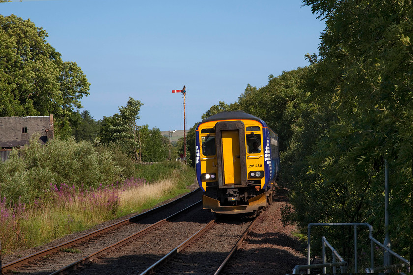 156436, SR 08.08 Glasgow Central-Stranraer (1A10, RT), Barrhill station 
 Barrhill station is situated high up in the hills between Girvan and Stranraer. The actual station is located some mile or so high above the village of the same name. In this shot, ScotRail 156436 arrives at the station working the 08.08 from Glasgow Central to Stranraer. The line is double track for a short distance through the station to act as an intermediate passing loop that is controlled by the tiny signal box. 
 Keywords: 156436 1A10 Barrhill station