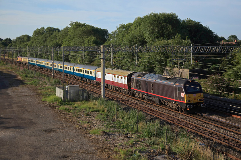 66005 & 67020, 06.00 London Euston-Southport Open golf special (1Z42), site of Roade station 
 67005 'Queen's Messenger' leads a mixed rake of stock pas the site of Roade station. It's heading the 06.00 London Euston to Southport special conveying golf fans to the Open being held at the Royal Birkdale course. 
 Keywords: 66005 67020 06.00 London Euston-Southport Open golf special 1Z42 site of Roade station