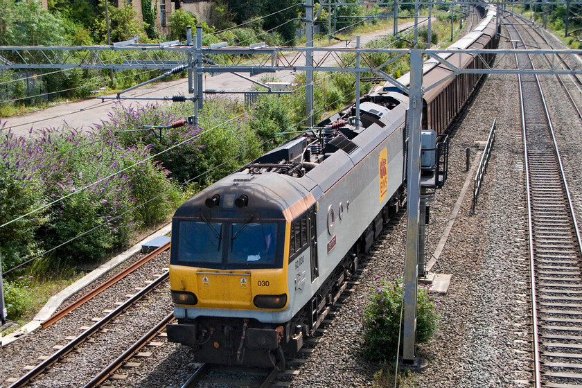 92030, 11.43 Wembley Yard-DIRFT (6B41), site of Roade station 
 The daily 6B41 11.43 Wembley to Daventry water train passes Roade hauled by 92030 'De Falla Ashford'. This is a regular and reliable lunchtime working in this location and produces some interesting locomotives often being, but not always, Class 92 hauled. Earlier in the morning the train starts from Dollands Moor running as 6B20 after coming through the tunnel the previous night. 
 Keywords: 92030 11.43 Wembley Yard-DIRFT 6B41 site of Roade station De Falla
Ashford