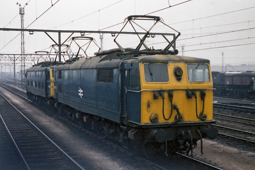 76016 & 76009, running round, Tinsley Yard 
 I am confused! I have this photograph labeled up as being taken in Tinsley yard and showing 76016 and 76009 running round. However, as our destination was Rotherwood Exchange sidings, why would the 76s run round here? Admittedly, the background does look more like the expanse of Tinsley rather than Rotherwood being was somewhat smaller. If anybody can help clear this one up I would appreciate the help! 
 Keywords: 76016 76009 running round Tinsley Yard