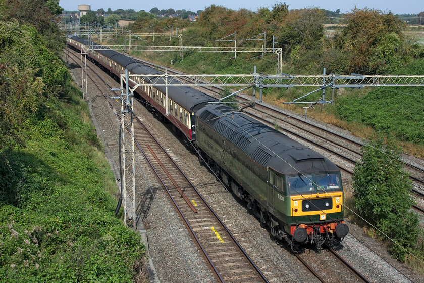 D1935, 08.57 Crewe HS-Southall LSL (5Z47, 13E), Victoria bridge 
 On a belting hot Saturday afternoon that was actually going to become the hottest day of the year D1935 'Roger Hosking MA 1925-2013' leads the 08.57 Crewe HS to Southall LSL empty coaching stock past Victoria bridge just south of Roade. Due to the closure of the slow lines due to engineering works to connect up the Sergo Logistics Park to the mainline diversions were in operation hence why this train is on the up fast line. 
 Keywords: D1935 08.57 Crewe HS-Southall LSL 5Z47 Victoria bridge Roger Hosking MA 1925-2013