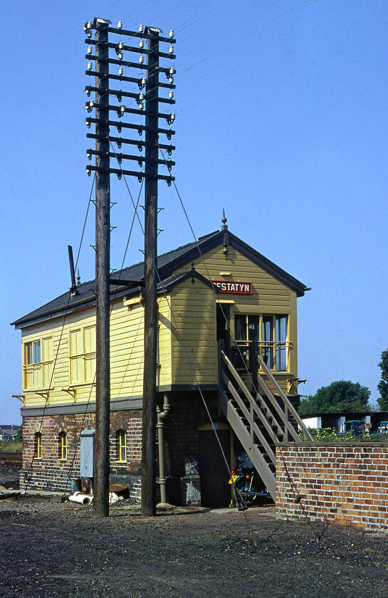 Prestatyn signal box (LNW c.1897) 
 Prestatyn signal box was located at the western end of the station in this popular North Wales resort town. Up until 1931 this box was actually named Prestatyn Number 2 with Number 1 being to the east of the station. However, this box was extended and Number one was closed. The box is a London and North Western Type 4 structure that opened in 1897 and closed on 26.03.18 with the opening of the Rhyl workstation in the Wales Railway Operating Centre (Cardiff). Notice the absolutely huge telegraph pole in this photograph towering above the box. 
 Keywords: Prestatyn signal box L&NWR