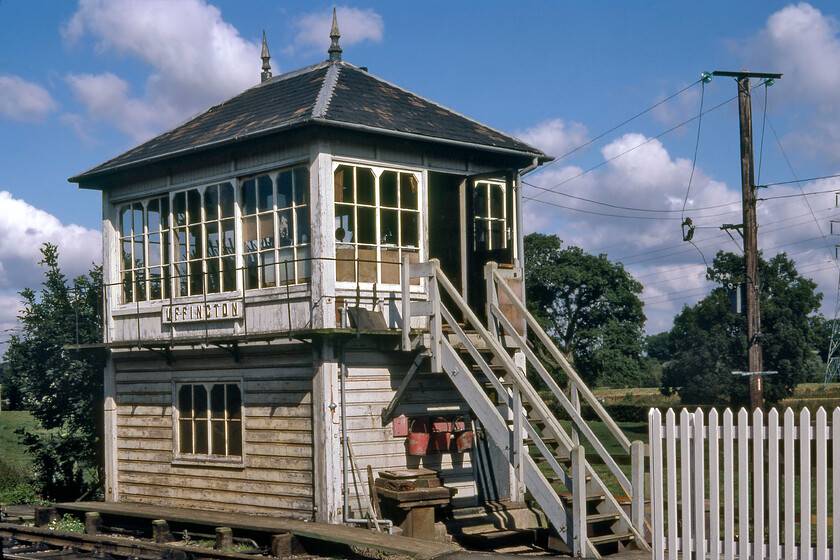 Uffington signal box (Mid, 1909) 
 Uffington signal box (or Uffington and Barnack to give it its official name) looks in need of a little care and attention from the S & T team and almost as though it might be being 'run down' for closure. In fact, the box is still open and looking smarter than ever https://www.ontheupfast.com/p/21936chg/29547725404/uffington-signal-box-midland-railway The box is a Midland Type 4 box opened in 1909 that replaced an 1870 structure on the opposite side of the line. The box looks good, despite its physical state, with its Midland wooden name board, its finials and the row of three fire buckets. 
 Keywords: Uffington signal box