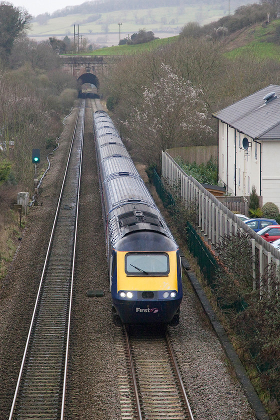 Class 43, 11.30 Bristol Temple Meads-London Paddington (1A15), Box A4 bridge 
 Two unidentified HST power cars work the 1A15 11.30 Bristol Temple Meads to London Paddington working. The train is about to pass under the A4 road bridge in the village of Box and plunge into Brunel's masterpiece Tunnel of the same name. Box's Middle Hill Tunnel can be seen in the distance, just beyond that as the line curves to the left was the site of Box station that closed in 1965. 
 Keywords: Class 43, 11.30 Bristol Temple Meads-London Paddington (1A15), Box A4 bridge