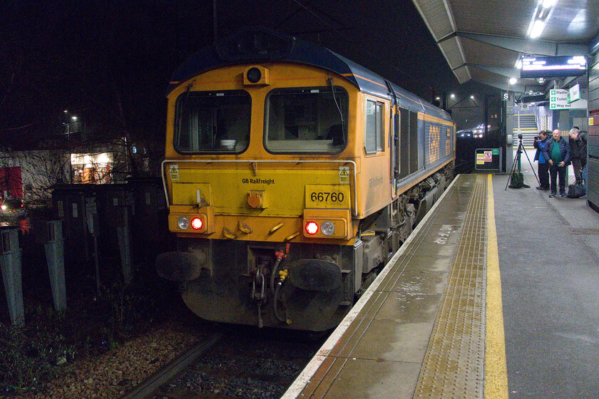 66760, 18.42 Hams Hall-Peterborough North Yard (0E23, 1L), Nuneaton station 
 66760 'David Gordon Harris' briefly pauses at Nuneaton station before getting the road behind a CrossCoutry unit heading for Leicester. The Class 66 was running as the 0E23 18.42 hams Hall to Peterborough Yard light engine move. It would be heading to GBRf's depot for servicing. Notice the throng of gathered photographers who had been either on or waiting for the Verney Venturer charter that had recently departed from Nuneaton. 
 Keywords: 66760 18.42 Hams Hall-Peterborough North Yard 0E23 Nuneaton station David Gordon Harris