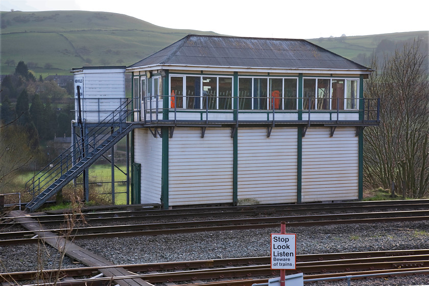 New Mills South Junction signal box (Midland, 1903) 
 Located on the Midland route at the western end of the Hope Valley line through the Pennines is New Mills. To the east of the town, the route splits with one line heading through Disley tunnel towards Stockport and the other heading directly to Piccadilly via Reddish North. At the junction, where the two lines split, is this former Midland box dating from 1903. It has had the uPVC treatment but still retains its balcony and its unmistakable Midland Railway appearance. It sits in commanding position high above the valley of the River Goyt. 
 Keywords: New Mills South Junction signal box