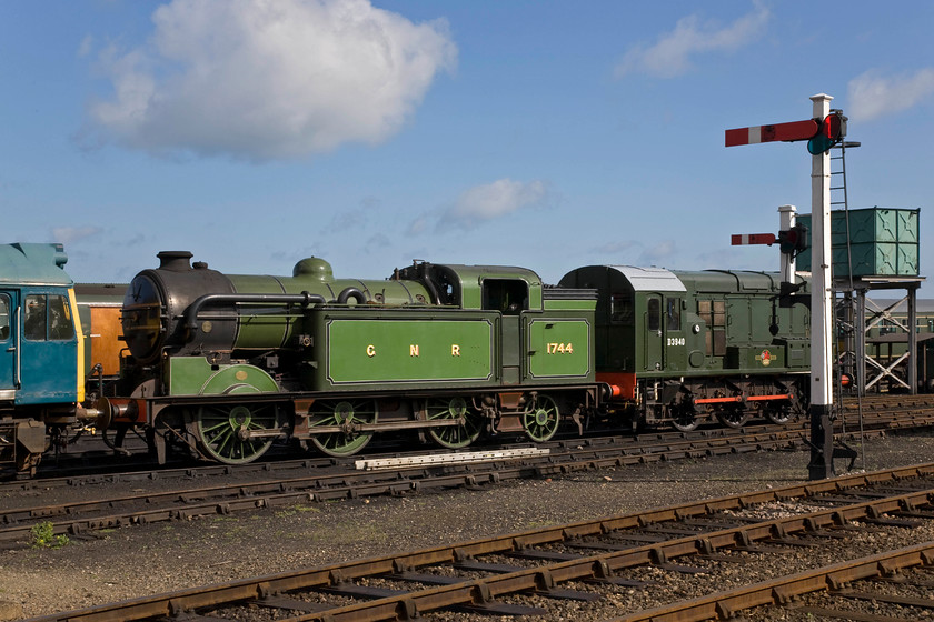 25057, 1744 & D3940, stabled, Weybourne yard 
 Under clear skies in Weybourne yard, an eclectic mix of motive power is seen. To the far left is former BR Class 25 number 25057 (ex (D5207) dating from 1963. This is followed centre by former GNR Class N2 number 1744 dating from 1921. Finally, to the right is one of the railway's resident shunters D3940 (ex 08772). 
 Keywords: 25057 1744 D3940 stabled Weybourne yard Poppy Line North Norfolk Railway GNR Class N2 Class 08 shunter