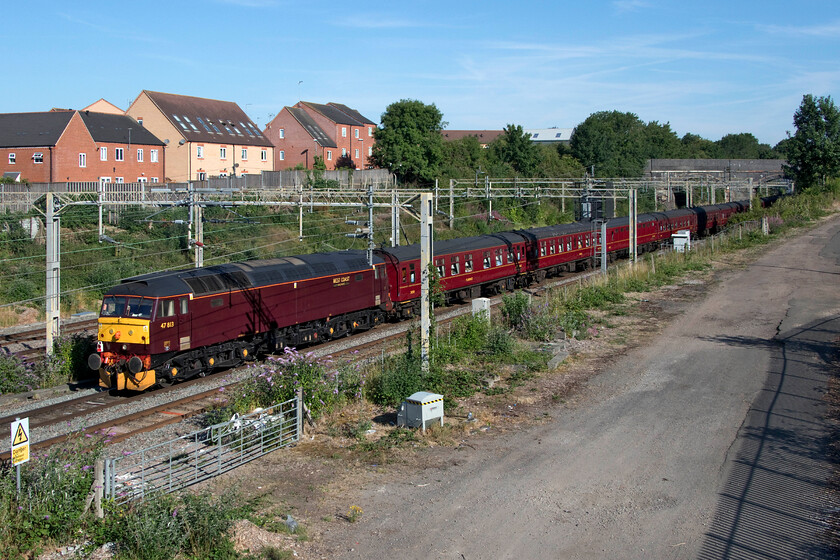 47813 outward leg of The Cheshireman, 06.39 London Euston-Chester (1Z86, 3E), site of Roade station 
 Doing what appeared to be nearly all the work at the rear of the train 47813 propels the Cheshireman charter from Euston to Chester with 6233 'Duchess of Sutherland' doing very little at the front (out of sight in this photograph). This was dues to the run of very dry weather over the last month or so meaning that lineside vegetation was at risk, but at least this would have done Network Rail's job for them! Dating from 1962 this particular Class 47 has been photographed a number of times by myself in the past, for example, see ..... https://www.ontheupfast.com/p/21936chg/29751820604/x47129-10-55-london-paddington-newquay 
 Keywords: 47813 The Cheshireman 06.39 London Euston-Chester 1Z86 site of Roade station