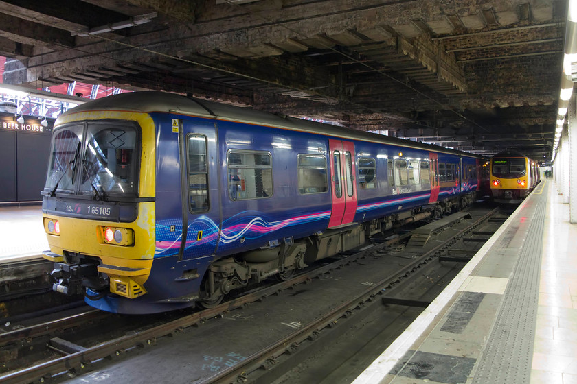 165105, GW 12.06 Worcester Foregate Street-London Paddington (1P47) & 360204, HC 13.51 Heathrow T5 London Paddington (2Y42), London Paddington station 
 I am not convinced that I would want to take a journey from Worcester to Paddington in a Turbostar class 165? 165105 has just done this journey having arrived at the capital with the 12.06 ex Worcester Shrub Hill. Next to it, the Heathrow Connect 13.51 service from terminal five formed by 360204 has now arrived. This is a pretty dire and oppressive part of Paddington station, I am sure that an effort could be made to paint the dark concrete roof white to brighten things up a bit? 
 Keywords: 165105 12.06 Worcester Foregate Street-London Paddington 1P47 360204 13.51 Heathrow T5 London Paddington 2Y42 London Paddington station