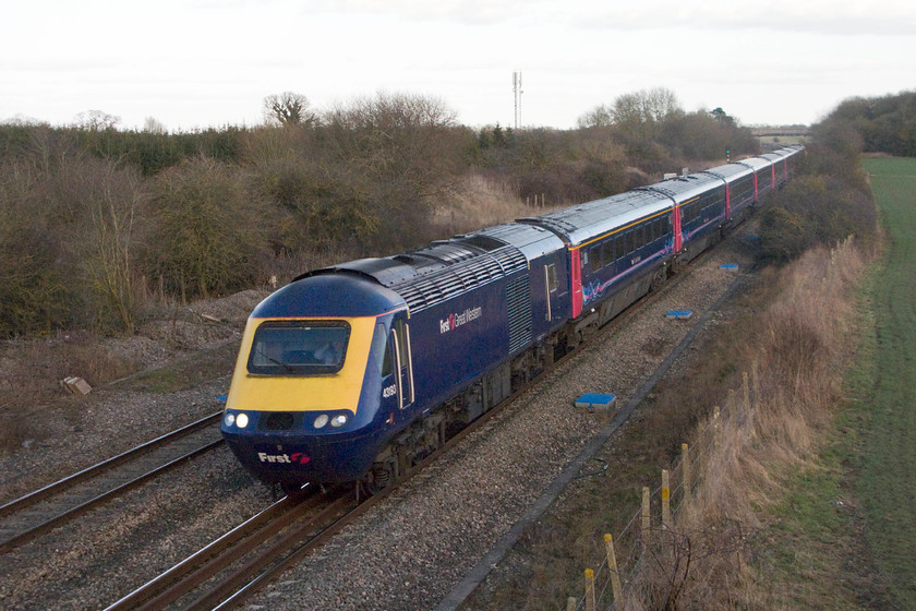 43193, GW 14.30 London Paddington-Weston-super-Mare (1C18), Shrivenham 
 The sun has now just set below the horizon behind me but there is just enough light to capture the 14.30 Paddington to Weston-super-Mare lead by 43193. This power car was one of six that were delivered late to the Eastern Region as part of 254056 sometime after their initial sets had been in service. The train is seen passing Shrivenham between Swindon and Didcot. 
 Keywords: 43193 14.30 London Paddington-Weston-super-Mare 1C18 Shrivenham