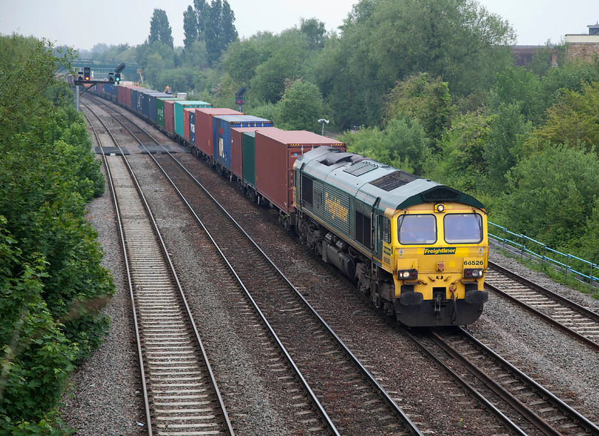 66526, 05.27 Leeds FLT-Southampton (4O90), Walton Well Bridge 
 The heavily loaded 05.27 Leeds to Southampton Freightliner headed by 66526 'Driver Steve Dunn (George)' slows down against adverse signals as it approaches Oxford taken from Walton Road bridge. This working was held for quite sometime just north of Oxford station as the other traffic around it was given priority. It only proves again how inadequate the layout and capacity is at Oxford. Freightliner named this 66 after their driver who was tragically killed in the Great Heck crash in February 2001. 
 Keywords: 66526 05.27 Leeds FLT-Southampton 4O90 Walton Well Bridge