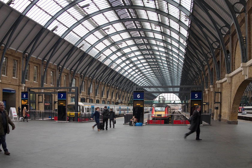 365527, GN 14.35 London King`s Cross-Peterborough (2P18) & 43320, GR 15.00 London King`s Cross-Stirling (1S22), London King`s Cross station 
 Many of us will remember the King's Cross of old when the glazing was blackened by grime, the concourse was uninviting and cramped with the warm stonework cluttered with signs and structures that had been added over the years. I have to compliment Network Rail on the superb job that they have done renovating the station making it a place worthy of its status as one of the UK's most important stations. In this image, 365527 is going to work the 14.35 to Peterborough whilst 43320 will power the rear of the 15.00 to Stirling. 
 Keywords: 365527 14.35 London King`s Cross-Peterborough 2P18 43320 15.00 London King`s Cross-Stirling 1S22 London King`s Cross station