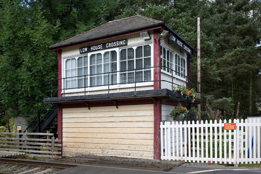 Low House Crossing signal box (Mid, 1900) 
 The delightfull Low House Crossing signal box is located at a remote spot getting its name from the nearby farm of the same name. It controls the second of the two level crossings on the entire length of the Settle and Carlisle route. The Midland box dating from 1899 once enjoyed a far more open aspect with the signalman on duty able to enjoy superb views of the fells from the rear of the box but the rapid growth of the massive coniferous plantation has put paid to that! 
 Keywords: Low House Crossing signal box Midland Railway