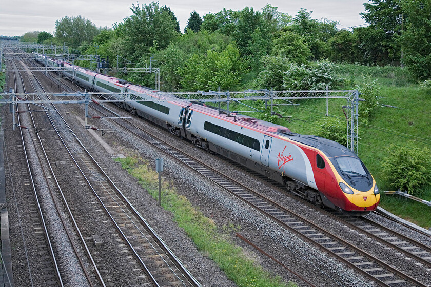 390123, VT 07.30 London Euston-Glasgow Central (1S42), Victoria bridge 
 Formally named 'Virgin Glory' until it was extended to an eleven-car set a couple of years ago 390123 passes Victoria bridge near Roade working the 07.30 Euston to Glasgow Central service. 
 Keywords: 390123 07.30 London Euston-Glasgow Central 1S42 Victoria bridge Virgin Pendolino