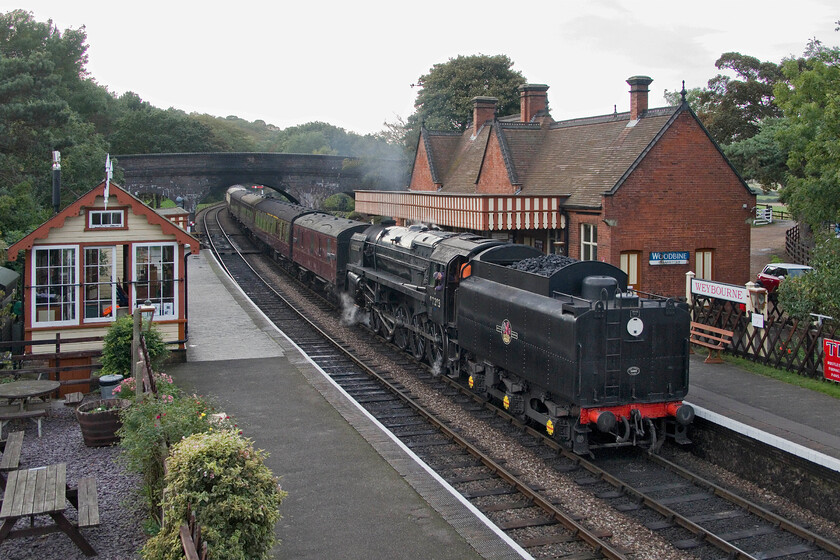 92203, 16.10 Holt-Sheringham, Weybourne station-19.10.23 
 I am not a particular fan of tender first photographs of steam locomotives. However, as this was going to be my last photograph of our holiday in Norfolk I have included it! 9F 92203 'Black Prince' eases the 16.10 Holt to Sheringham into Weybourne station. This is the last service train of the day on the North Norfolk Railway's green timetable that would see the 9F deposit the stock at Sheringham to then return light engine to Weybourne for servicing. The end of another week in Norfolk wondering when we will return. 
 Keywords: 92203 16.10 Holt-Sheringham Weybourne station I am not a particular fan of tender first photographs of steam locomotives. However, as this was going to be my last photograph of our holiday in Norfolk I have included it! 9F 92203 'Black Prince' eases the 16.10 Holt to Sheringham into Weybourne station