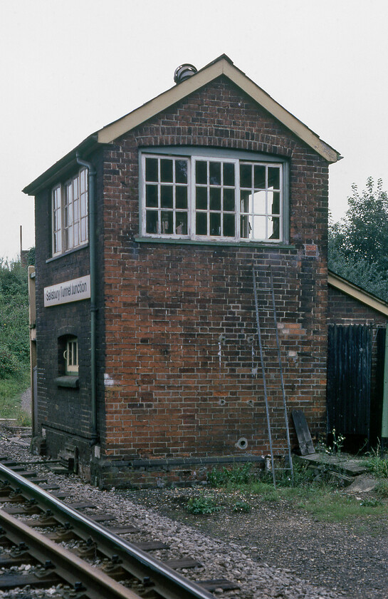 Salisbury Tunnel Junction signal box (LSW, c.1870) 
 I managed to blag access to Salisbury Tunnel Junction signal box and then got permission to venture trackside to take this photograph still wearing my orange BR issue tabard that I was given at Salisbury station earlier in the morning. The box was a small but functional London and South Western structure dating from circa 1870. In common with many of the L&SW boxes of this era, it was entirely brick built with a hipped roof and noticeably fewer windows than might be expected. However, Tunnel Junction does have windows on both sides to facilitate sighting of both lines that it controlled being situated in the V of the junction. 
 Keywords: Salisbury Tunnel Junction signal box L&SWR LSW London and South Western Railway