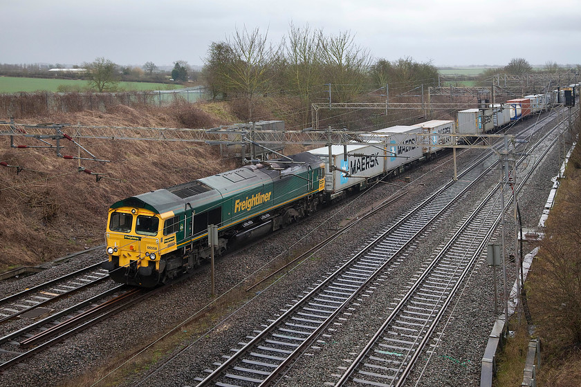 66588, 09.32 Felixstowe North-Crewe Basford Hall (4M88), Victoria Bridge 
 It's now raining again at Victoria Bridge as 66588 brings the 09.32 Felixstowe North to Crewe Basford Hall Freightliner past. I have visited this spot, just a short distance from my home, in all weather from winter blizzard conditions to high summer and it remains one of my favourites. 
 Keywords: 66588 4M88 Victoria Bridge