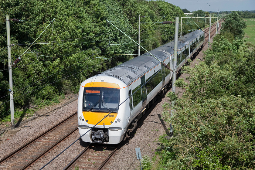 357034, CC 15.27 Shoeburyness-London Fenchurch Street (2B11, RT), Warley Hall Lane TQ606878 
 With the summer sun shining down on the Essex countryside, 357034 passes Warley Hall Lane bridge between Laindon and Upminster with the 15.27 Shoeburyness to London Fenchurch Street. This was the last shot of the day before Andy and I headed for home after another successful day on the lineside! 
 Keywords: 357034 2B11 Warley Hall Lane TQ606878