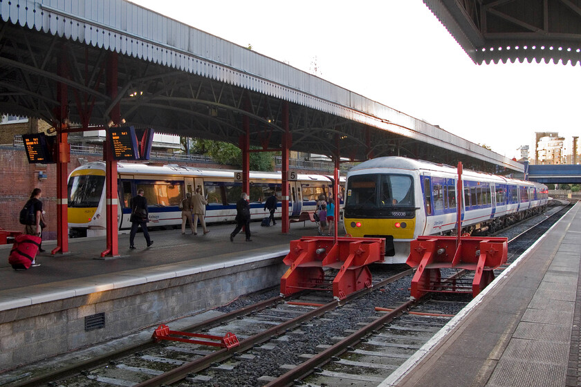 168111, CH 19.15 London Marylebone-Birmingham Moor Street & 165038, CH 19.18 London Marylebone-Banbury, London Marylebone station 
 A busy Sunday evening scene at Marylebone station. To the left the 19.15 'fast' service to Birmingham Moor Street worked by 168111 boards and will leave in the next. few minutes. Meanwhile, to the right 165038 prepares to work the slightly later 19.18 'slow' to Banbury. My wife, son and I travelled on this train all the way to Banbury despite only needing to get to Kings Sutton. On arrival at Banbury we would wait a few minutes to get the last up stopper of the day back south to King's Sutton. If our train was late and we were to miss this train I am not too sure what Chiltern would do about it? 
 Keywords: 168111 19.15 London Marylebone-Birmingham Moor Street 165038 19.18 London Marylebone-Banbury London Marylebone station Chiltern Turbo