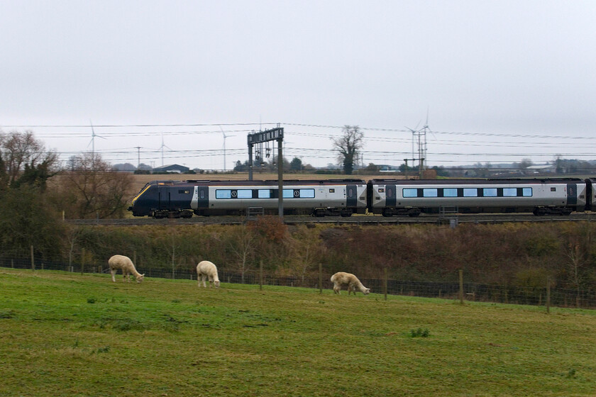 221105, VT 13.02 London Euston-Chester (1D87, 1L), between Roade & Ashton 
 If plans come to fruition, it is now less than two weeks before Avanti will retire their Voaygers from operations on the WCML with the takeover of the Class 805 and 807s complete. However, this journey has been a long and tortuous one and I will not be holding my breath when the timetable changes on 15.12.24! 221105 passes between the villages of Roade and Ashton working the 1D87 13.02 Euston to Chester service.

NB As it transpired, this was my final photograph of a Voyager working for AWC on the WCML. With all the Class 805s and 807s in service by the start of the new timetable (as mentioned above) the final 221s were handed back to Beacon Rail - note added 19.12.24 
 Keywords: 221105 13.02 London Euston-Chester 1D87 between Roade & Ashton AWC Avanti West Coast Voyager