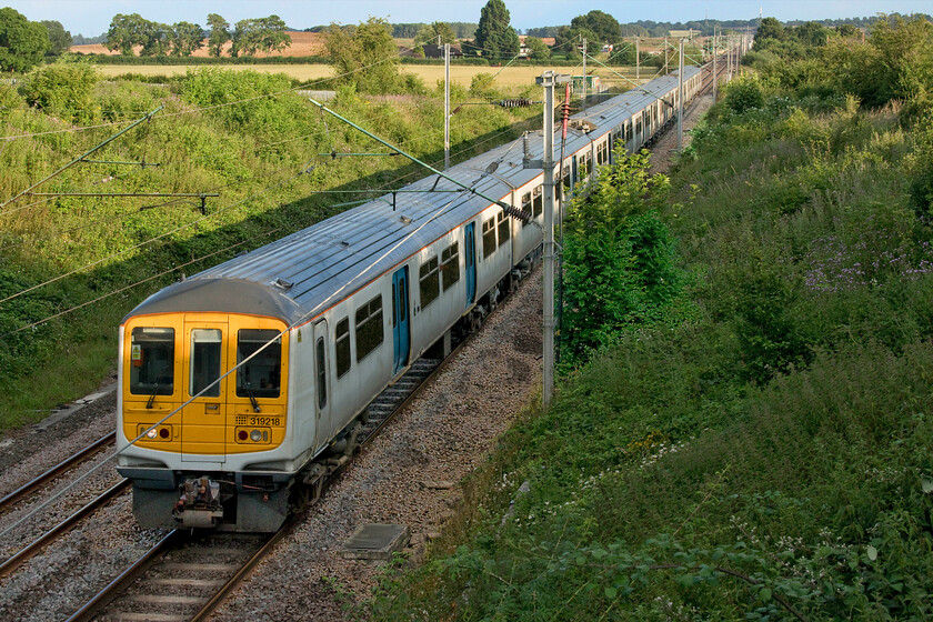 319218 & 319012, LN 18.19 London Euston-Northampton (2N69, RT), Milton Malsor SP738560 
 In lovely warn evening light 319218 and 319012 work the 18.19 Euston to Northampton evening commuter service. It is services such as this that the pandemic may well put paid to as city workers continuing to change the way that they work choosing home rather than the office for most if not all of their working week. 
 Keywords: 319218 319012 18.19 London Euston-Northampton 2N69 Milton Malsor SP738560