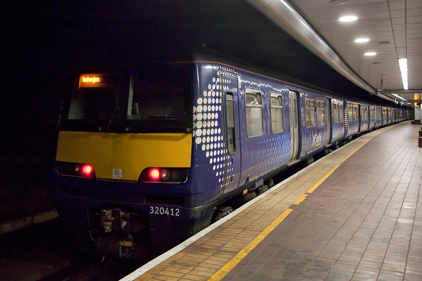 320412, SR 18.33 Dalmuir-Rutherglen (2R16, 6L), Glasgow Central Low Level station 
 In the catacombs that is Glasgow Central Low Level station, 320412 pauses working the 18.33 Dalmuir to Rutherglen. Andy and I took this train from Partick and alighted here in order to make our way up to High Level and on to Ayr. 
 Keywords: 320412 2R16 Glasgow Central Low Level station